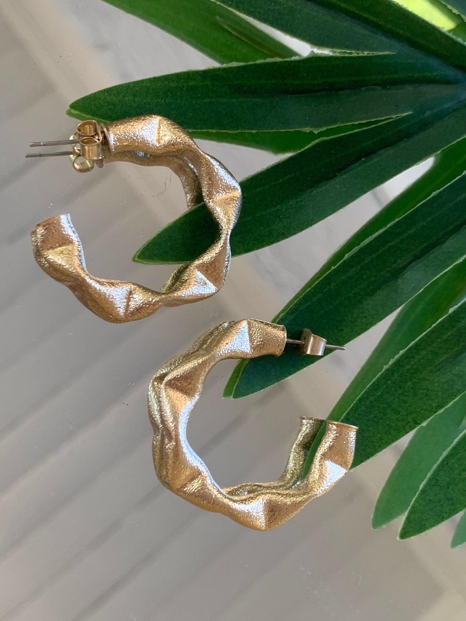 ON EDGE BRASS HOOPS